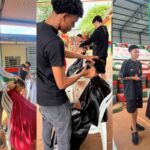 Alunos e professores do curso de Barbearia da FESC participam de ação social na Nave Sal da Terra, em São Carlos.